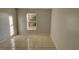 Spacious bedroom with tile floors and window with security bars at 3101 E 23Rd Ave, Tampa, FL 33605