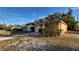 House exterior with a sidewalk and mature trees at 3101 E 23Rd Ave, Tampa, FL 33605