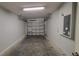 Garage with overhead door and concrete floor at 3101 E 23Rd Ave, Tampa, FL 33605