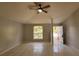 Bright living room with tile floors and ceiling fan at 3101 E 23Rd Ave, Tampa, FL 33605