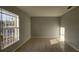 Light-filled living room featuring tile floors and large window at 3101 E 23Rd Ave, Tampa, FL 33605