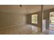 Spacious living room with tile floors and large window at 3101 E 23Rd Ave, Tampa, FL 33605