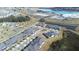 Aerial view of community with houses, roads, and a lagoon at 31349 Cabana Rye Ave, San Antonio, FL 33576