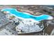 Aerial view of resort-style pool and expansive sandy beach at 31349 Cabana Rye Ave, San Antonio, FL 33576