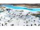 Aerial view of a resort-style pool with a sandy beach and water features at 31349 Cabana Rye Ave, San Antonio, FL 33576