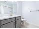 Modern bathroom featuring gray vanity and a quartz countertop at 31349 Cabana Rye Ave, San Antonio, FL 33576