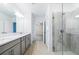 Modern bathroom with double vanity and glass shower at 31349 Cabana Rye Ave, San Antonio, FL 33576