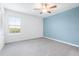 Bedroom with gray carpet and window with blinds at 31349 Cabana Rye Ave, San Antonio, FL 33576