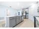 Modern kitchen with island and view into living room at 31349 Cabana Rye Ave, San Antonio, FL 33576