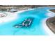 Aerial view of a lagoon with floating inflatable obstacles at 31349 Cabana Rye Ave, San Antonio, FL 33576