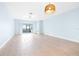 Spacious living room with light blue walls and tile flooring at 31349 Cabana Rye Ave, San Antonio, FL 33576