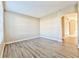 Living room with wood-look floors and archway at 3440 Santa Rita Ln, Land O Lakes, FL 34639