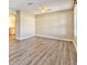 Living room with wood-look floors and ceiling fan at 3440 Santa Rita Ln, Land O Lakes, FL 34639