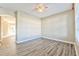 Living room with wood-look floors and ceiling fan at 3440 Santa Rita Ln, Land O Lakes, FL 34639