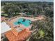 Community pool with a hot tub and surrounding deck at 3440 Santa Rita Ln, Land O Lakes, FL 34639