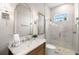 Elegant bathroom with marble vanity, shower, and frameless glass enclosure at 3571 Recurve Cir, Sarasota, FL 34240