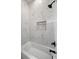 Clean bathroom with a bathtub and marble tile shower surround at 3571 Recurve Cir, Sarasota, FL 34240