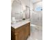 Elegant bathroom with marble vanity, shower, and frameless glass enclosure at 3571 Recurve Cir, Sarasota, FL 34240