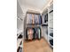 Well-organized closet with custom shelving and hanging rods at 3571 Recurve Cir, Sarasota, FL 34240