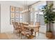 Farmhouse style dining room with wood table and chairs at 3571 Recurve Cir, Sarasota, FL 34240