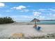 Beachfront view with picnic table and lounge chair at 3710 41St S Way # C, St Petersburg, FL 33711