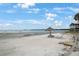 Beachfront view with picnic table and lounge chair at 3710 41St S Way # C, St Petersburg, FL 33711