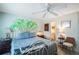 Bright bedroom with ceiling fan and en-suite bathroom at 3710 41St S Way # C, St Petersburg, FL 33711