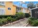 Condo building exterior with walkway and landscaping at 3710 41St S Way # C, St Petersburg, FL 33711