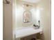 Small vanity with mirror and hair dryer in a condo bathroom at 3710 41St S Way # C, St Petersburg, FL 33711