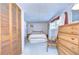 Bedroom with double bed, dresser and closet at 37418 Hammond Dr, Zephyrhills, FL 33541