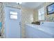 Bright laundry room features washer, dryer, and exterior access at 37418 Hammond Dr, Zephyrhills, FL 33541