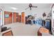 Bedroom with wood floors, lots of packed items, and ceiling fan at 4001 Keene Rd, Plant City, FL 33565