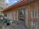 Front view of the house, showcasing its rustic wooden exterior at 4001 Keene Rd, Plant City, FL 33565