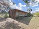 Rustic house exterior with a large yard and mature trees at 4001 Keene Rd, Plant City, FL 33565