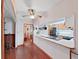 Kitchen with wood cabinets and view into hallway and dining room at 4001 Keene Rd, Plant City, FL 33565