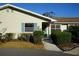 Cute Florida home with light-colored siding, manicured landscaping, and a walkway to the entrance at 407 Lake Point Ct # 4E, Sun City Center, FL 33573