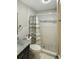 Updated bathroom with tile shower and vanity at 4099 30Th N St, St Petersburg, FL 33714