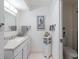 Clean bathroom with white vanity and shower/tub combo at 4316 Tahitian Gardens Cir # H, Holiday, FL 34691