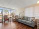 Spacious living room with water views and comfy seating at 4316 Tahitian Gardens Cir # H, Holiday, FL 34691