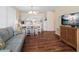 Living room boasts light gray sofa and wood-look floors at 4316 Tahitian Gardens Cir # H, Holiday, FL 34691