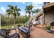 Private deck with fire pit and seating, overlooking lush landscape at 4334 Spinnaker Cove Ln, Tampa, FL 33615