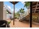 Deck with fire pit, stairs, and view of tropical landscaping at 4334 Spinnaker Cove Ln, Tampa, FL 33615