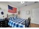 Charming bedroom with a double bed and American flag decor at 4334 Spinnaker Cove Ln, Tampa, FL 33615