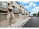 Row of townhouses with attached garages and stairs leading to the front entrances at 4334 Spinnaker Cove Ln, Tampa, FL 33615