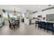 Modern kitchen with white cabinets, stainless steel appliances and an island at 4334 Spinnaker Cove Ln, Tampa, FL 33615