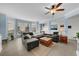 Light blue living room with sectional sofa and built-in shelving at 4334 Spinnaker Cove Ln, Tampa, FL 33615