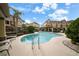 Inviting kidney-shaped pool with lounge chairs at 4334 Spinnaker Cove Ln, Tampa, FL 33615