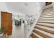 Elegant staircase with wood treads and white railings at 4334 Spinnaker Cove Ln, Tampa, FL 33615