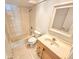 Clean bathroom with a tub, toilet and vanity at 4405 W Fair Oaks Ave # 10, Tampa, FL 33611