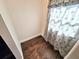 Small room with hardwood floors and window coverings at 4405 W Fair Oaks Ave # 10, Tampa, FL 33611